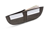 A black Nantucket Front Pocket Wallet by Tradevia with money in it.