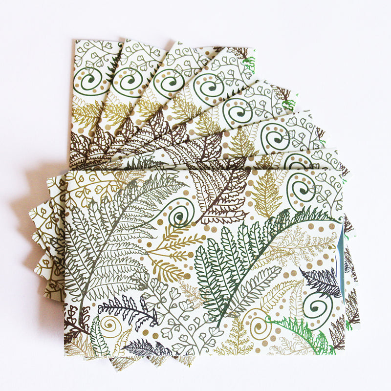 A stack of Tradevia RFID Blocking Package of Credit Card Sleeves with leaves on them, designed for RFID blocking to prevent skimming attacks.