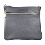 The Tradevia Ellis River Crossbody Bag in Leather features a sleek black genuine leather design, an adjustable leather strap, and a gold zipper pocket on the front.