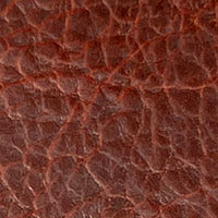 A close-up image of a Tradevia American Bison leather checkbook cover texture.