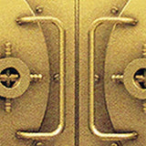 A Gold Vault door with two Tradevia RFID Blocking Credit Card Sleeves handles on it, designed to prevent skimming attacks.