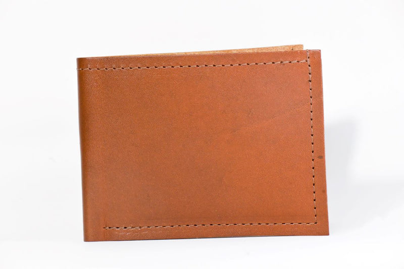 A genuine cowhide leather Heritage Wallet with stitching, made in USA by Tradevia.