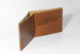 A tan Tradevia Heritage Wallet made of genuine cowhide leather on a white surface.
