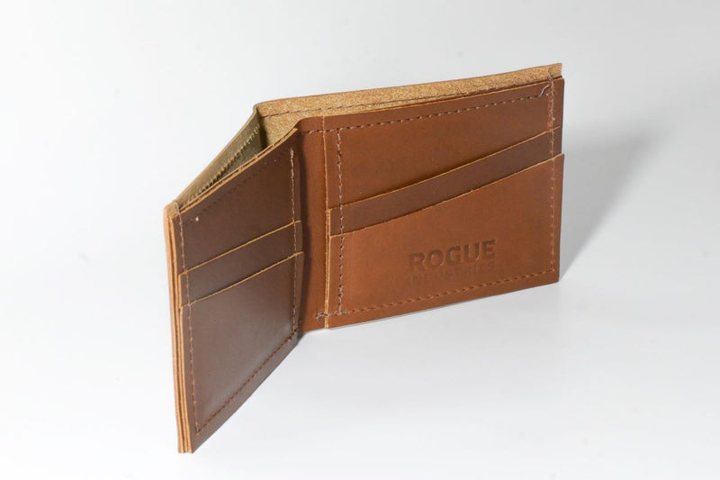 A tan Tradevia Heritage Wallet made of genuine cowhide leather on a white surface.