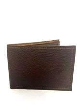 A Heritage Wallet from Tradevia made in USA with stitching.