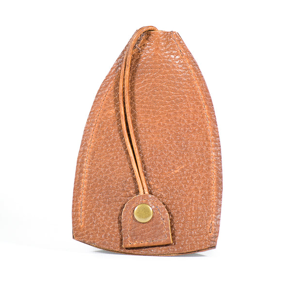 A durable cowhide key fob case, featuring a brown, textured leather pouch with a snap button closure and a looped strap attached to the front. Introducing the Rogue Leather Key Protective Case by Tradevia.