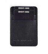 Introducing the Rogue Money Clip by Tradevia: a stylish black card holder crafted from genuine top-grain leather. It features two "CREDIT CARD"-labeled slots, and its compact design makes it ideal for front pocket carry, effortlessly blending functionality with style.