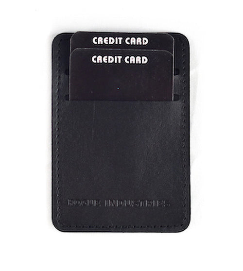 Introducing the Rogue Money Clip by Tradevia: a stylish black card holder crafted from genuine top-grain leather. It features two "CREDIT CARD"-labeled slots, and its compact design makes it ideal for front pocket carry, effortlessly blending functionality with style.