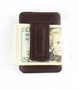 A front pocket Rogue Money Clip from Tradevia, crafted from genuine top-grain leather, designed to hold a stack of U.S. twenty-dollar bills.