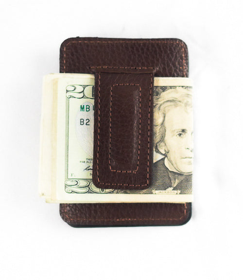 A front pocket Rogue Money Clip from Tradevia, crafted from genuine top-grain leather, designed to hold a stack of U.S. twenty-dollar bills.