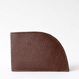 A brown Tradevia NON-RFID Made in Maine wallet on a white background.