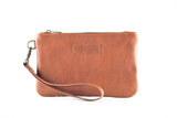 This Tradevia Fore Street Tote Bag, expertly crafted from full-grain leather, features a zipper and detachable strap.