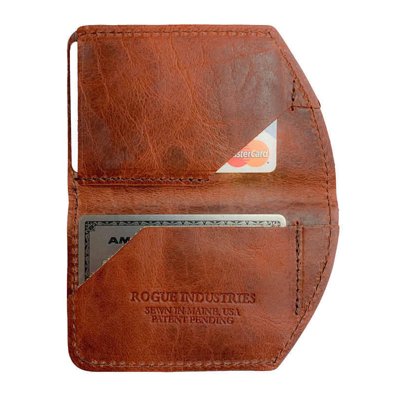 A brown, slim leather Tradevia Minimalist Wallet with a credit card in it.