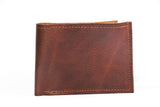 A genuine cowhide leather Heritage Wallet with stitching, made in USA by Tradevia.