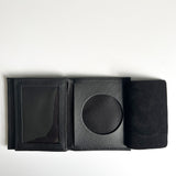 A black Tradevia Leather Badge Holder Wallet with a black coin inside, designed as a badge holder for first responders.