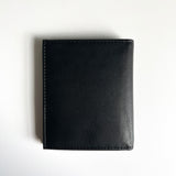 A Tradevia Leather Badge Holder Wallet on a white surface.