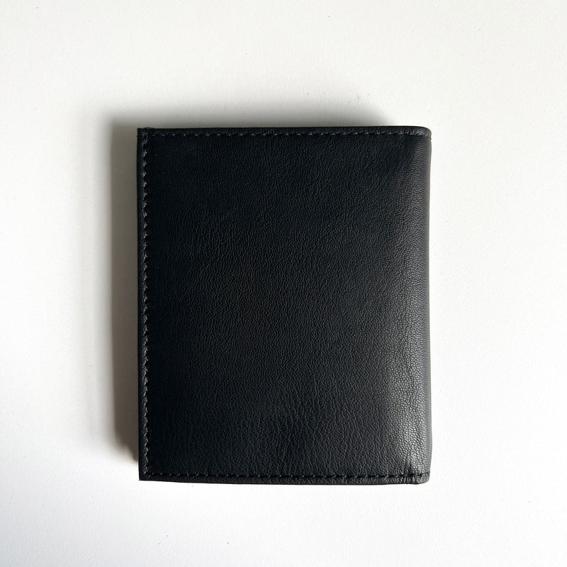 A Tradevia Leather Badge Holder Wallet on a white surface.