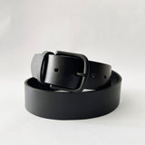 A handmade Tradevia Baxter Leather Belt - 1.5" Wide on a white background.
