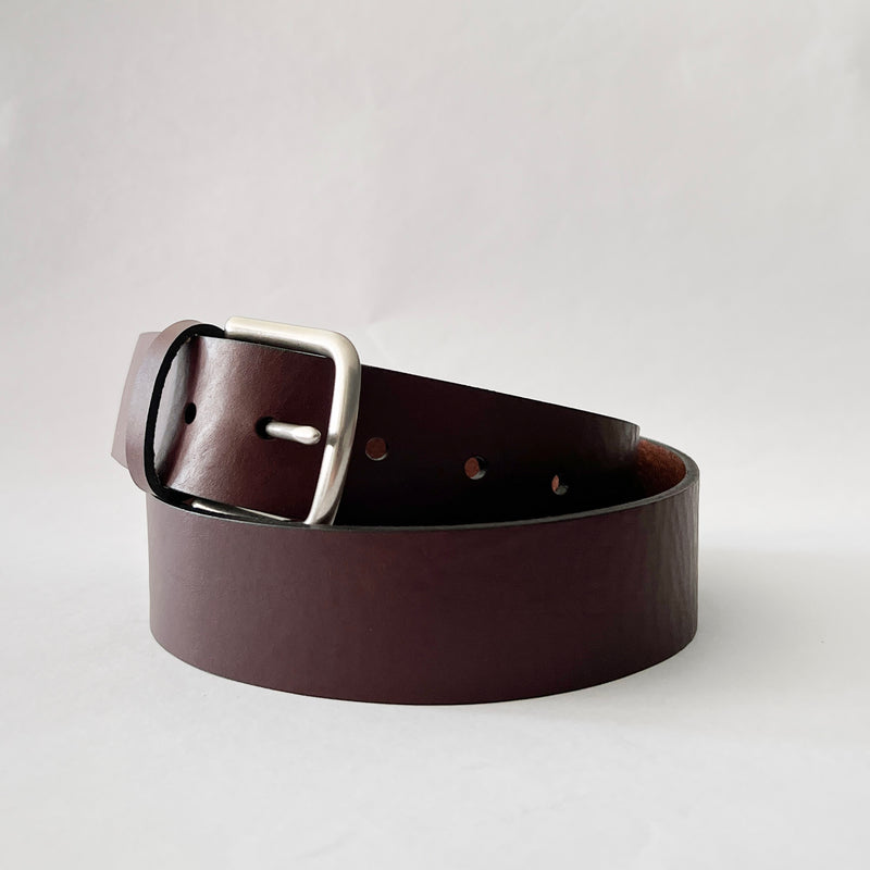 A Baxter Leather Belt - 1.5" Wide by Tradevia on a white background.