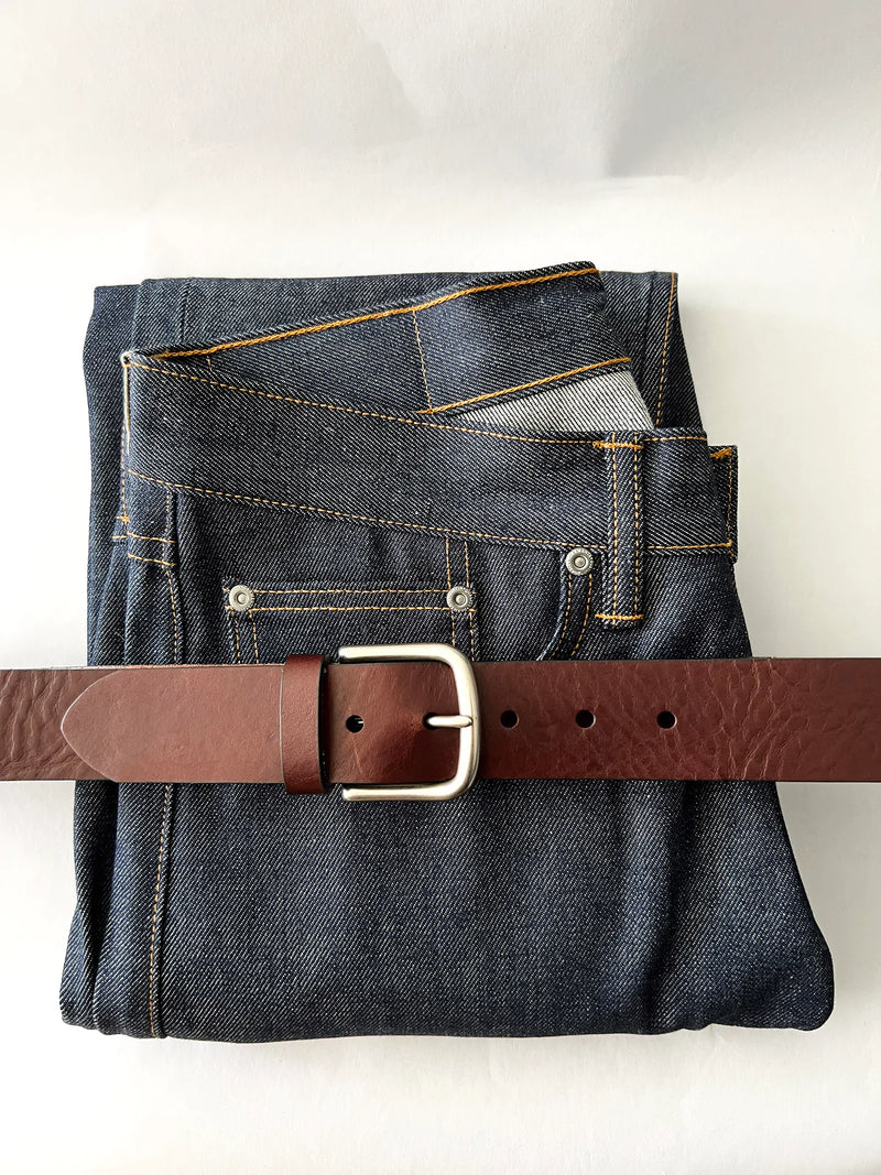 A pair of jeans with a premium Baxter Belt and Made in Maine Rogue Wallet Bundle from Tradevia.