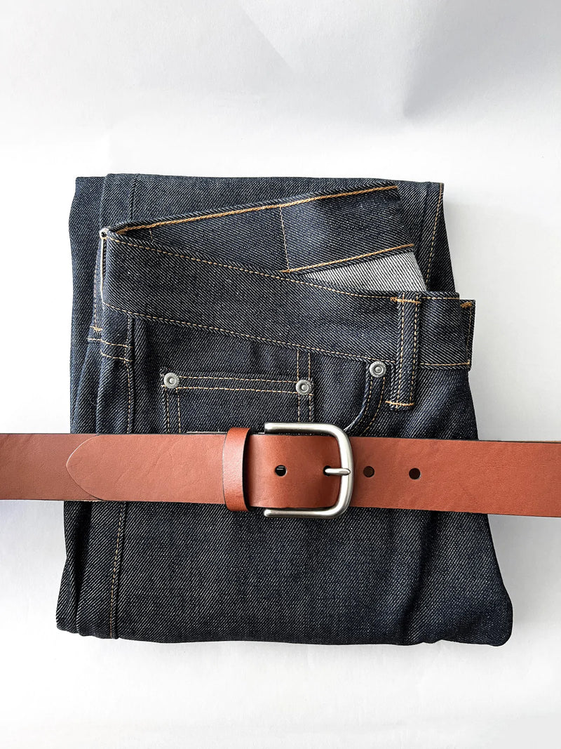 A pair of jeans with a brown Baxter Belt and Made in Maine Rogue Wallet Bundle by Tradevia.
