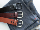Three premium Baxter Belts from Tradevia on a pair of jeans.