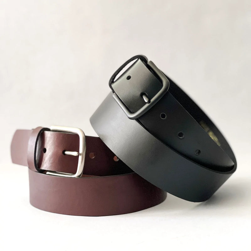 Three different colored Tradevia premium cowhide leather belts on a white background.