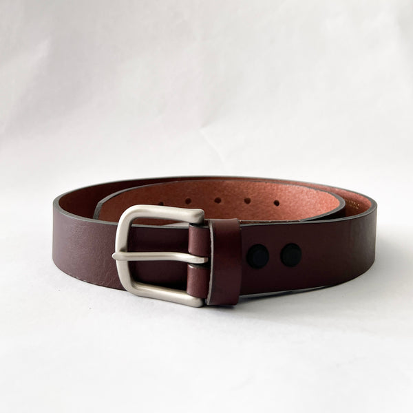 A handcrafted Chamberlain Leather Belt - 1.25" Wide by Tradevia on a white background.