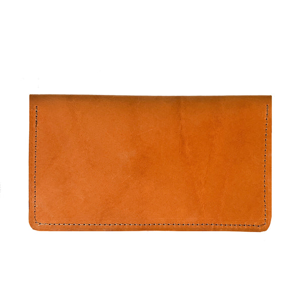 An Tradevia Leather Checkbook Cover on a white background.