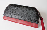 A black and red Tradevia RFID Blocking Clutch - Ostrich Print wallet.