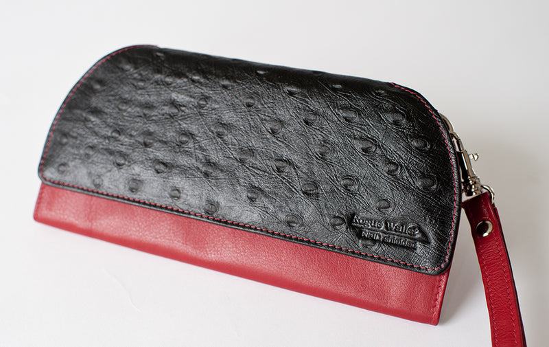 A black and red Tradevia RFID Blocking Clutch - Ostrich Print wallet.