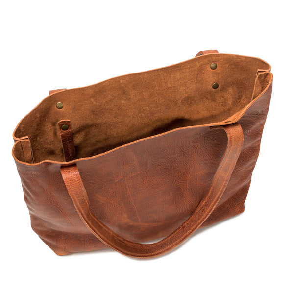 A brown full-grain leather Fore Street tote bag by Tradevia with a handle.