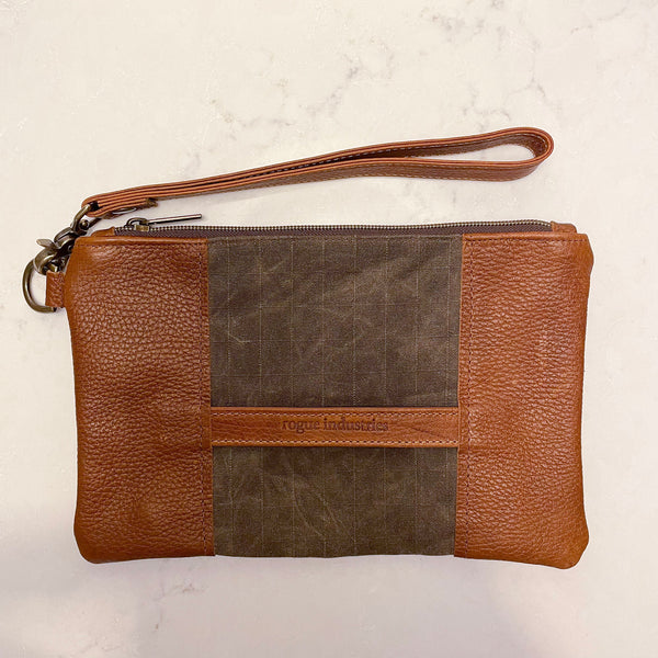 A brown and tan leather zippered Eastport clutch by Tradevia.