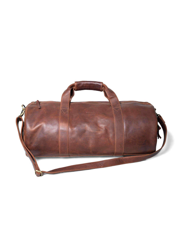 A Seal Cove by Tradevia leather duffle bag on a white background.