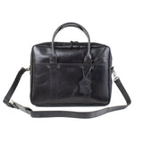 A black genuine leather Katahdin Leather Briefcase with a removable strap by Tradevia.
