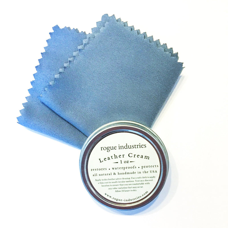A blue cloth next to a tin of Tradevia All Natural Leather Cream.