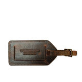 A brown Tradevia cowhide leather luggage tag on a white background, Made in Maine.
