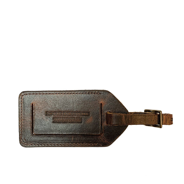 A brown Tradevia cowhide leather luggage tag on a white background, Made in Maine.