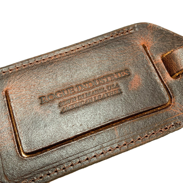 An image of a brown Rogue Leather Luggage Tag from Tradevia.
