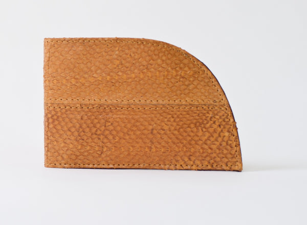 A brown sustainable Rogue Front Pocket Wallet in Salmon Leather with stitching.
