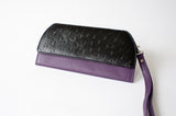 A black and purple leather RFID Blocking Clutch - Ostrich Print by Tradevia.