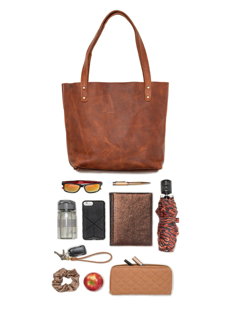 A Tradevia Fore Street Tote Bag and various items.