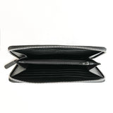 A black zippered clutch made of premium leather on a white background by Tradevia.