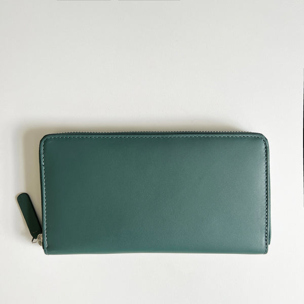 A green, premium leather Tradevia Leather Smartphone Clutch on a white surface.