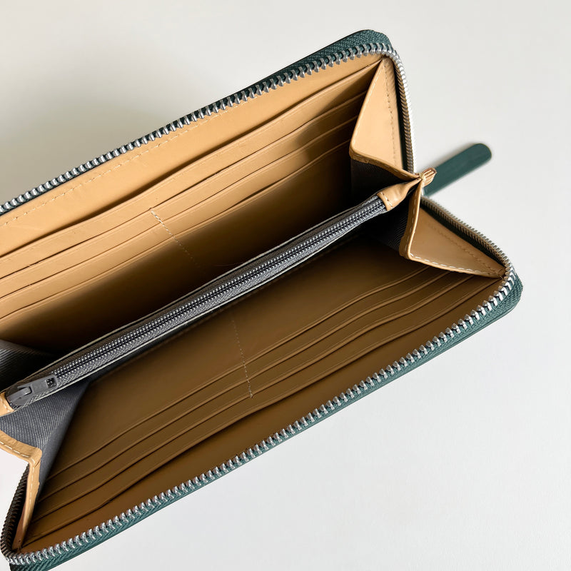 A Tradevia Leather Smartphone Clutch with zippers inside.