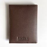 A Tradevia brown leather passport holder with the word "focus" monogrammed on it.