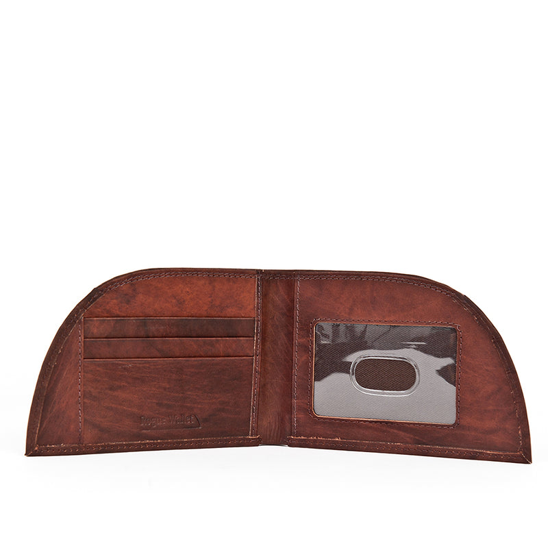 A brown premium cowhide wallet with a silver label from Tradevia.