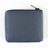 A grey Tradevia RFID blocking Nylon Zip Around Wallet with a YKK zipper on a white surface.