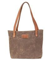 A durable Allagash River tote bag with brown leather handles by Tradevia.
