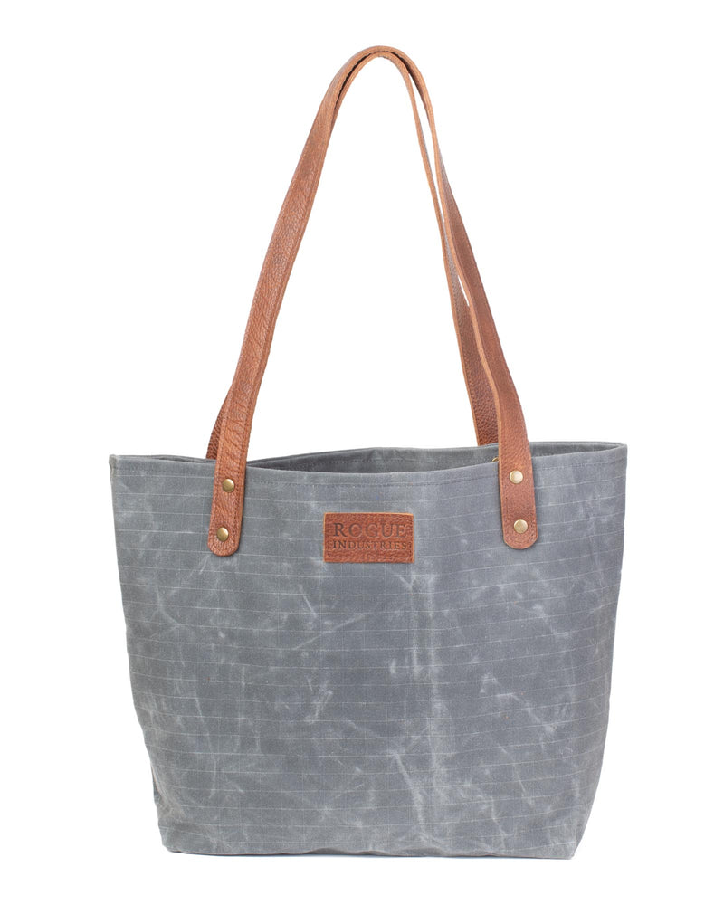 The durable Allagash River tote bag with brown leather handles by Tradevia.